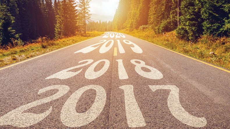 Empty asphalt road and New year 2018, 2019, 2020 concept. Driving on an empty road in the mountains to upcoming 2018, 2019, 2020 and leaving behind old years. Concept for success and passing time.