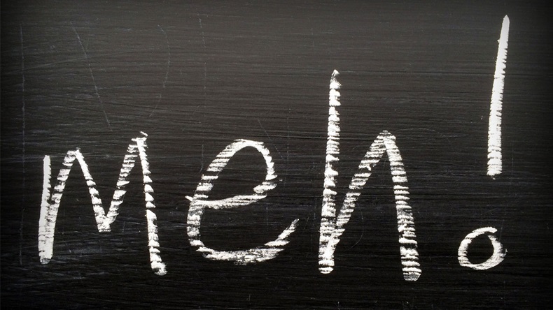 The word Meh written on a blackboard in white chalk as an expression of boredom or indifference when giving an opinion