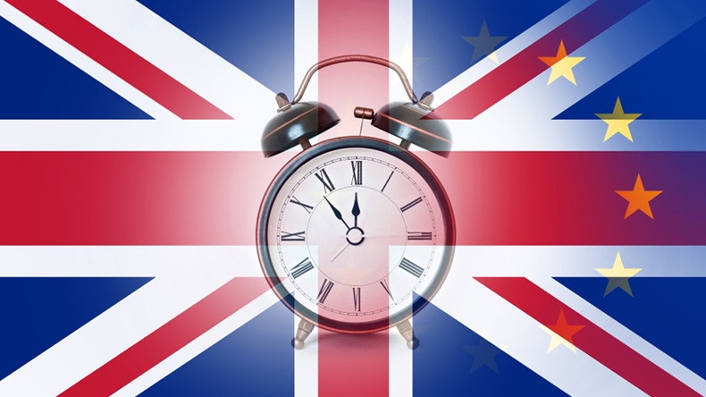 A BREXIT deadline concept. With an alarm clock over layered with the union Jack and E.U flags. - Image 