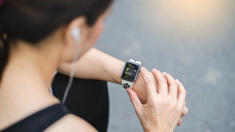 Bangkok,Thailand ,9 Apr 2018 : Woman choose Activity App outdoor run program on Apple Watch before run Working out - Image 