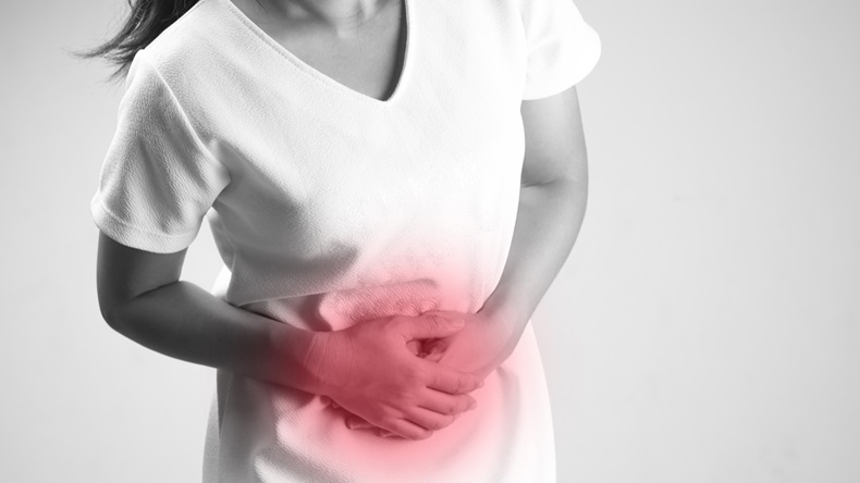 Sick woman having a stomach ache, abdomen in black and white, Period cramps concept - Image 