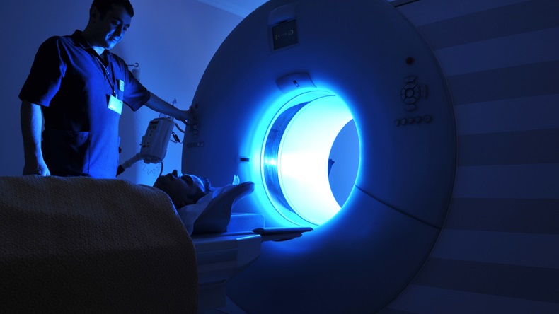 Magnetic Resonance Imaging machine operator and a patient -a series of MRI. - Image 