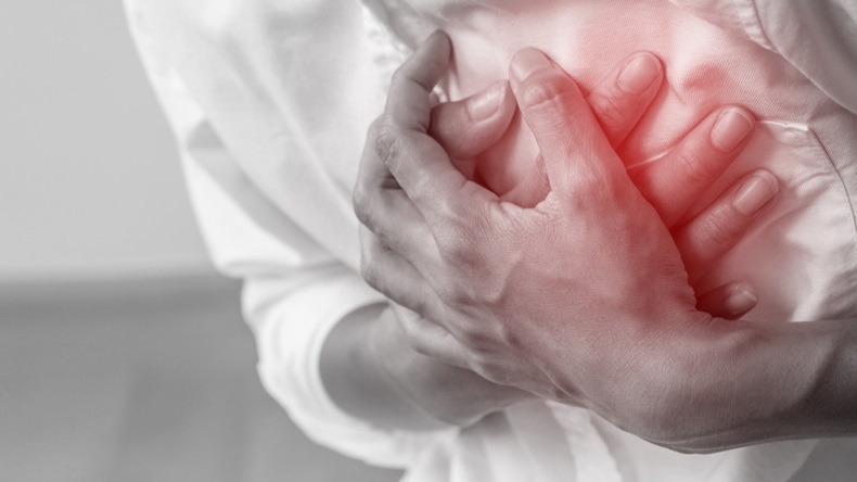 Man clutching his chest from acute pain.Heart attack symptom-Healthcare and medical concept. - Image 