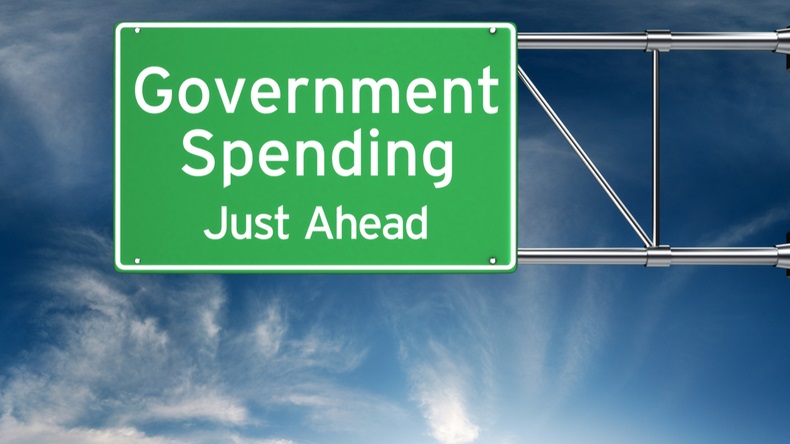 Government spending just ahead . Street exit sign showing the increase of government spending in the future. - Illustration 