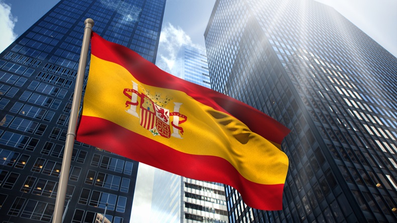 Spain national flag against low angle view of skyscrapers - Image 