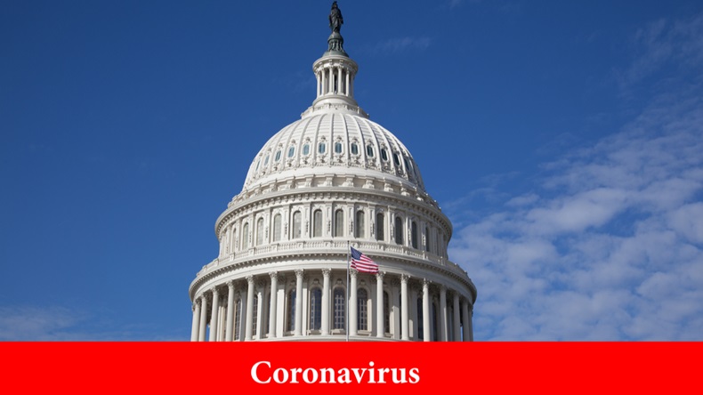 The inscription on a red background coronavirus on the background of the building of the US Congress building of the capitol building on a clear day. Close-up. Epidemic concept in washington and usa