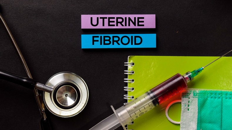 Uterine Fibroid on top view black table with blood sample and Healthcare/medical concept.