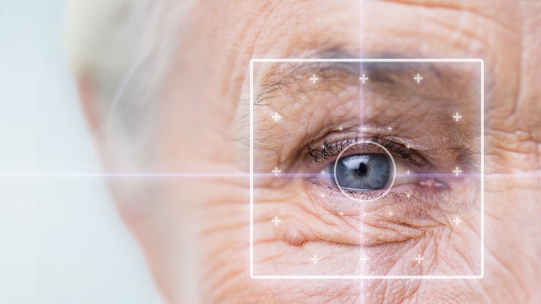 age, vision, surgery, eyesight and people concept - close up of senior woman face and eye with laser light