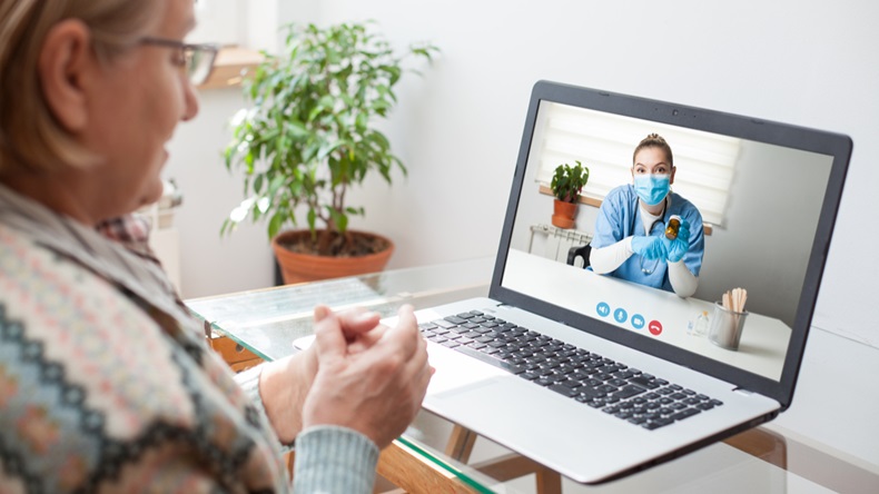 Young female doctor consulting with elderly woman over video help line virtual medical appointment,GP prescribing medication to senior patient, telemedicine diagnosis, therapy and treatment concept