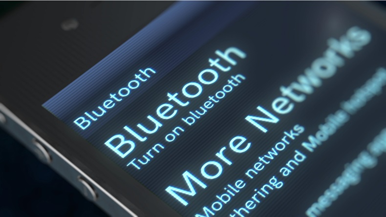 A 3d rendering of a smartphone with inscription stating Bluetooth and More Networks icon.