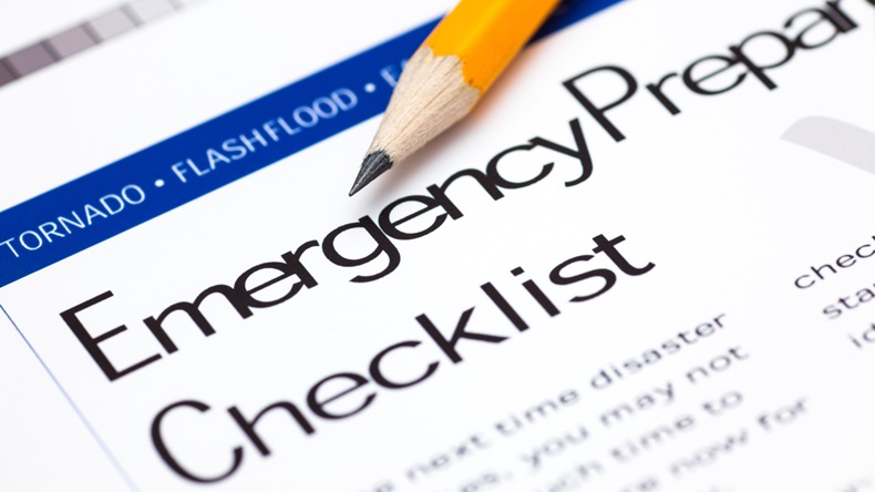 Close-up of an emergency preparedness checklist with pencil.