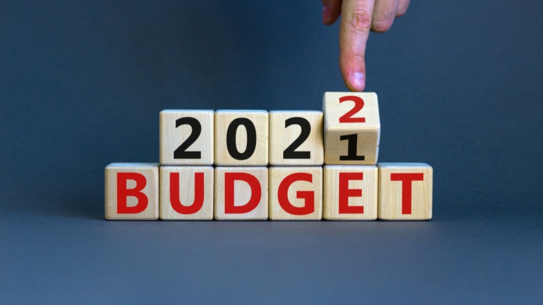 FIngertip flips a block to turn "2021 Budget" to "2022 Budget"