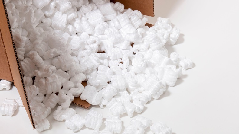 Cardbox spills plenty of polystyrene or white styrofoam packing pieces.