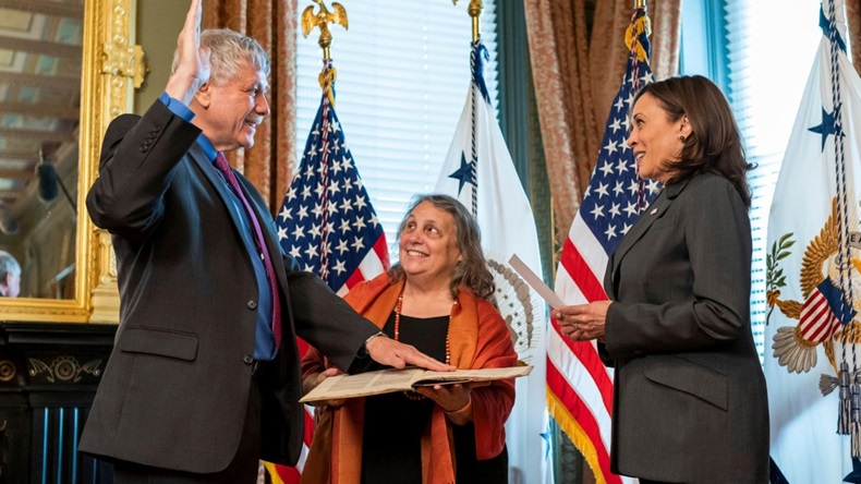 U.S. Vice President Kamala Harris holds a ceremonial swearing in of Eric Lander as the Director of the Office of Science and Technology Policy, as his wife Lori Lander holds a 500-year-old Hebrew text, in the Eisenhower Executive Office Building of the White House June 2, 2021 in Washington, DC. 