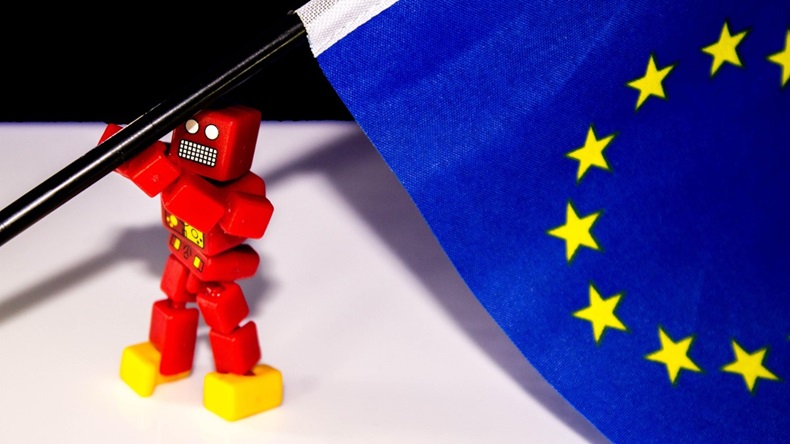 A toy robot raising the European flag