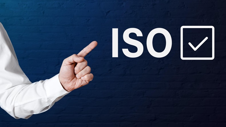 Businessman hand points to the word ISO with check tick icon
