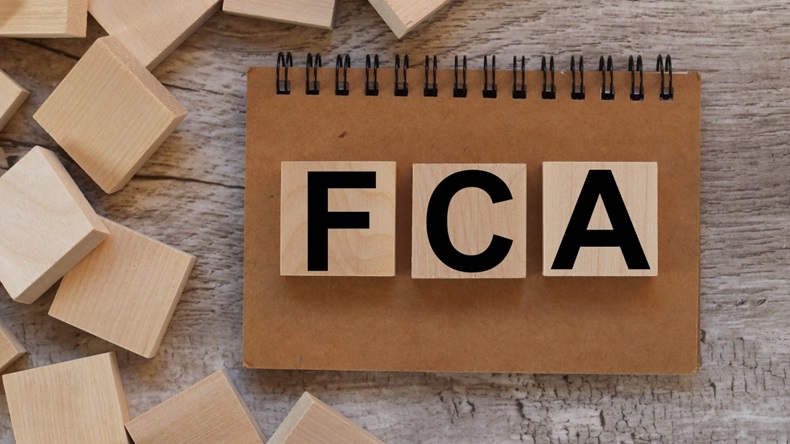 Wooden blocks spell out the letters "FCA."
