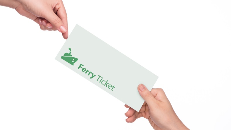 Woman's hand holding a ferry ticket on white background close-up