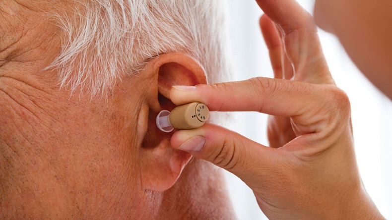 Putting Hearing Aid In
